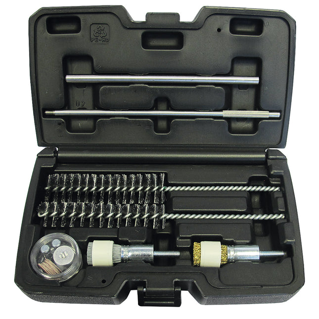 A set of metal brushes and cleaning tools for cleaning injector seats, displayed in an open black case.