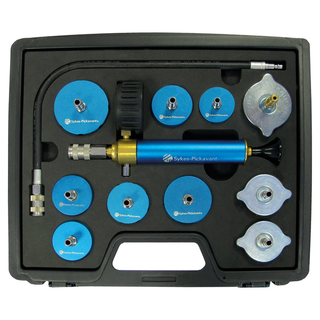 A cooling system pressure test kit with blue and silver components, including pressure caps, a high capacity metal bodied hand pump, and a quick-connect hose assembly, mounted in a black case.